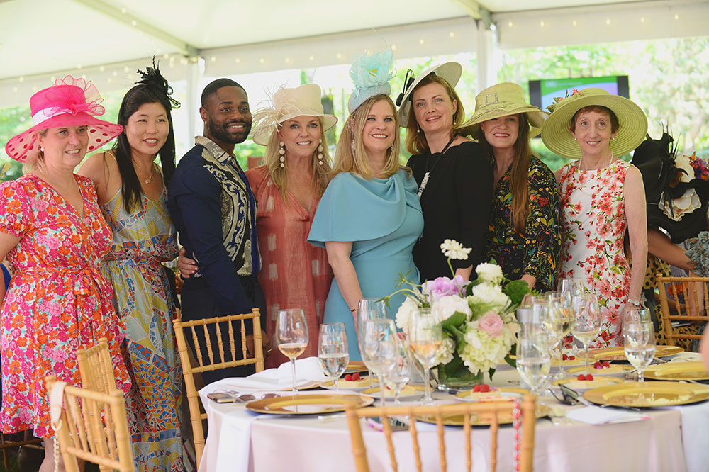 Group posing at Hats in the Garden event