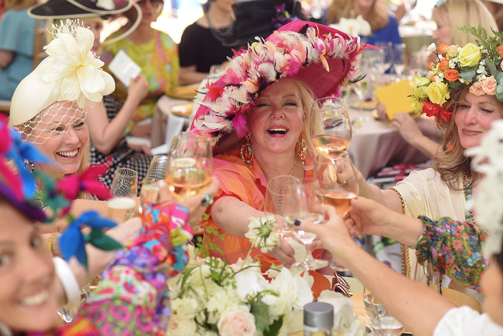 Ladies toasting at Hats in the Garden