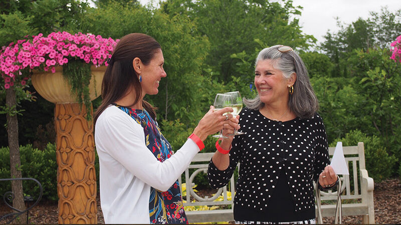 Mother and Daughter toasting with wine glasses